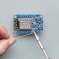 Miniware TS80P soldering iron in use on an electronics board